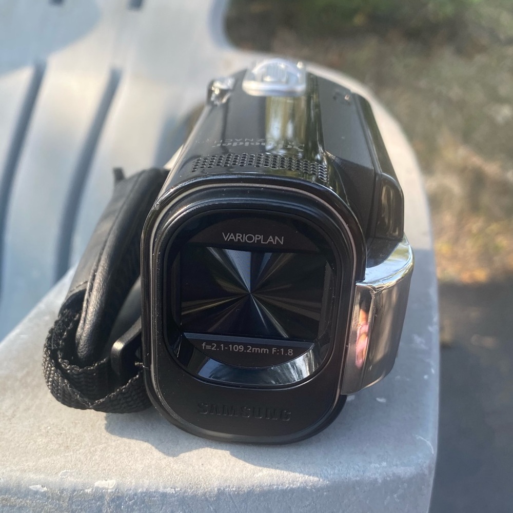 Camcorder with case and charger.